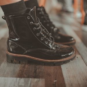 Close up of sports shoes on a dark wooden floor