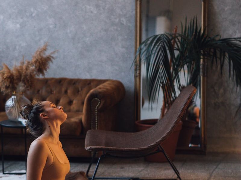 Modern minimalist interior with exercise mat and soft lighting